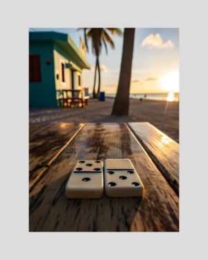 Affiche artistique de deux dominos sur une table en bois avec vue sur la plage antillaise au coucher du soleil